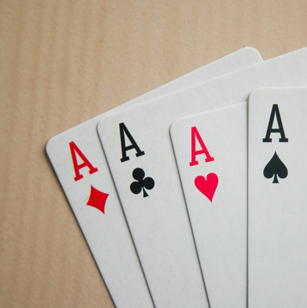 rustic playing cards on wooden table